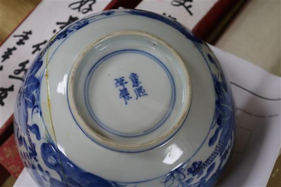 Two Chinese blue and white bowls and a famille rose bowl, 18th/19th century (3) Diameter 23cm